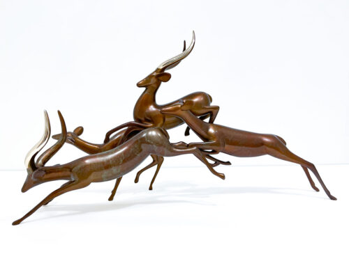 Impalas Leaping Sculpture 360 by Loet Vanderveen at Art Leaders Gallery. Group of Impalas shown in the Silver Burgundy patina. Hand crafted bronze animal sculpture.