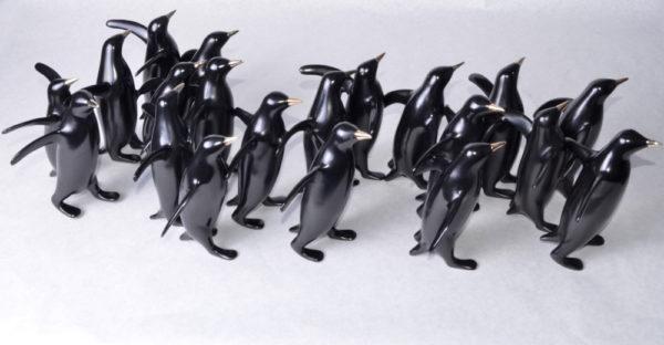 Large Penguin Group Sculpture 378 by Loet Vanderveen shown in the black patina.