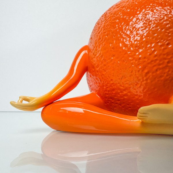 Tangelohm from the Out of the Bowl Series by Thad Markham. A peaceful orange practicing yoga and finding inner peace.