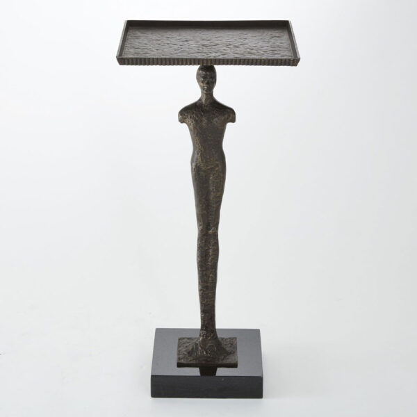 Our Modern Woman Table captures humanity at its most basic. The iron figure of the woman stands tall on a black granite base. A shallow lipped iron top sits on top of the figure giving a sleek surface.