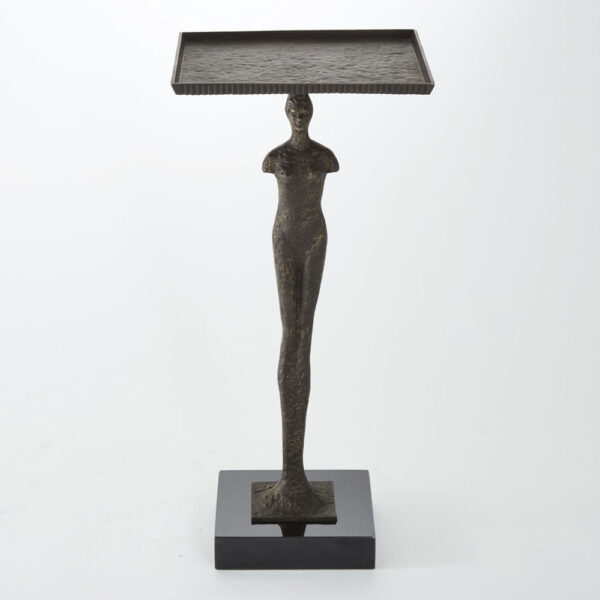 Our Modern Woman Table captures humanity at its most basic. The iron figure of the woman stands tall on a black granite base. A shallow lipped iron top sits on top of the figure giving a sleek surface.