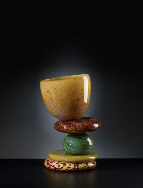 Vessel with stacked, glass rock