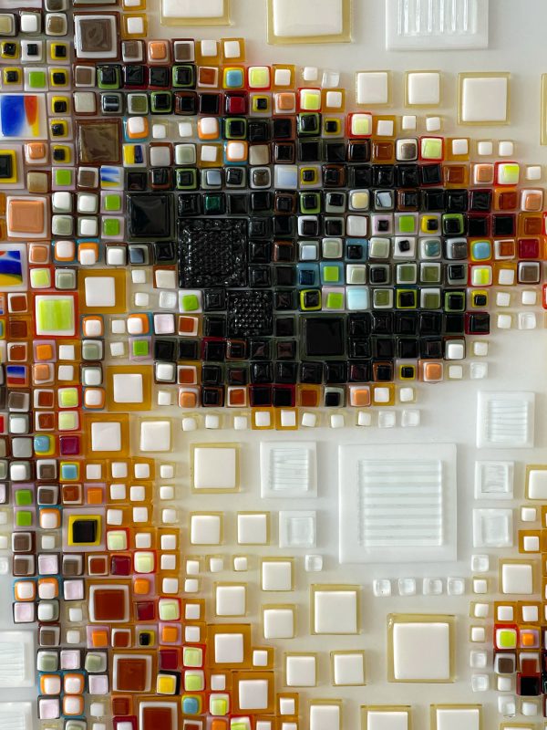 Isabelle Scheltjens creates complex mosaic portraits using stacks of colorful hand-cut fused glass. This is an example of modern pointilism.