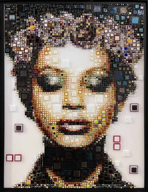 Ubuntu (Purple) by Isabelle Scheltjens. Pieces of glass in different colors, sizes, and textures are melted together and applied like dots of paint used by pointillists to create Pop art portraits of modern celebrities, icons, and female faces. This portrait was inspired by American singer and actress Beyonce.