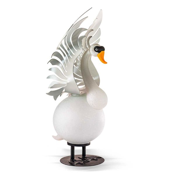 Hektor is a large, outdoor glass sculpture of a trumpeter swan. white body and head, metal raised wings and feet.