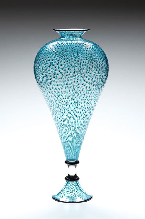 Teal Vessel from the Splash Series by American glass artist Kenny Pieper. 25 inch tall glass vessel with intricate teal and white linework.