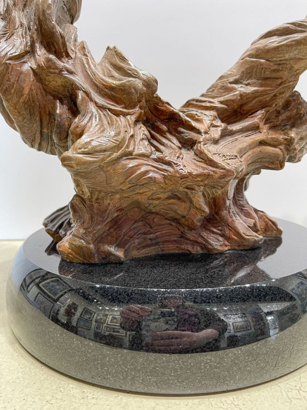 Whirlwind by Martin Eichinger - man and woman dancers holding hands spinning with hands outstretched. Bronze sculpture on polished granite base.