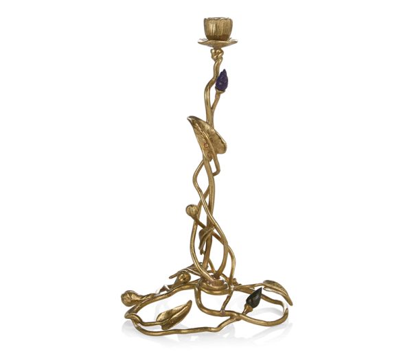 Enchanted Garden Candle Holder, Item #122924 Michael Aram  Enchanted Garden is a collection inspired by the magical quality of spring. Sculpts of intertwined vines and stems gracefully emerge from a fantasy garden adorned with snails and semi-precious stones, while a morning mist of textured stainless steel and dew drops made of Austrian crystals add a sense of narrative, whimsy, and opulence. Each Michael Aram metal object undergoes a series of grinding, buffing, and polishing techniques. Variations or 'imperfections' in the product's finish are characteristic of the creation process. Due to this handmade nature, no two pieces are ever exactly alike. Materials: Natural Brass, Precious Stones, Swarovski Crystals Medium: Granite, Nickelplate, Natural & Oxidized Brass Price: $295.00 | RETIRED - LAST TWO LEFT Size: 9.25"H