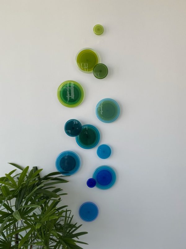 Ingrid by LouAnn Wukitsch at Art Leaders Gallery. 20 glass circles going from green to blue