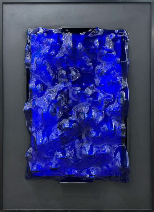 Current by Dane Porter at Art Leaders Gallery. Blue slumped glass on matted black surface and a thin black frame